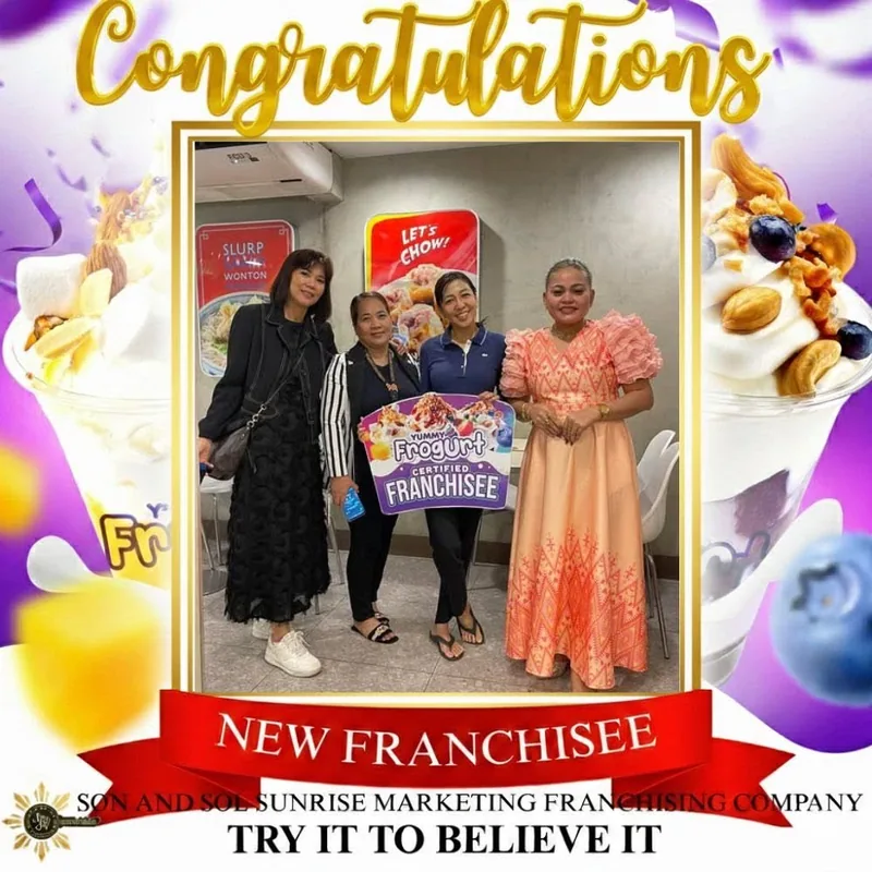 Family of franchisees holding their certified franchisee marker